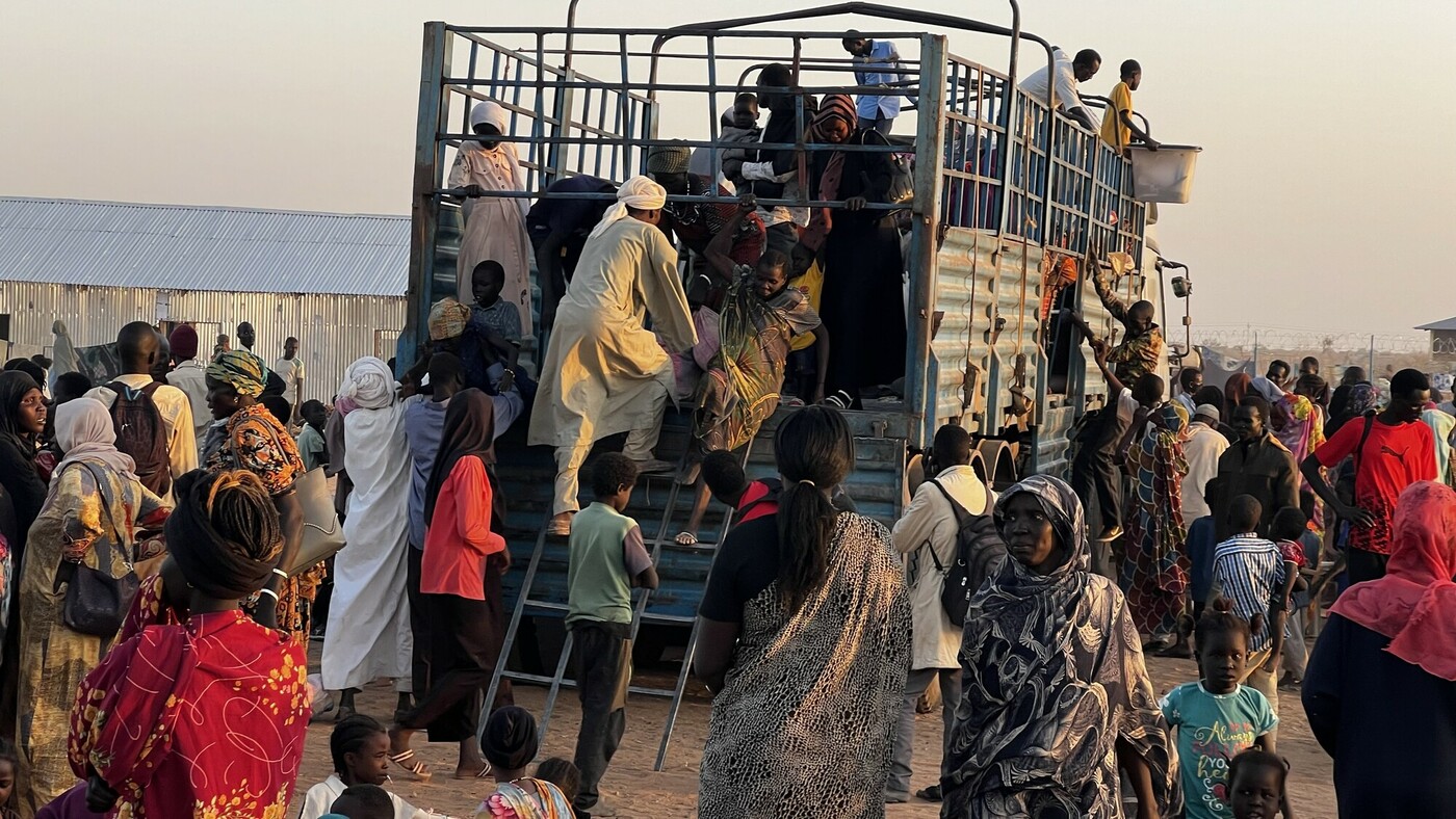 Refugees and ethnic South Sudanese arrived at new transit site on Sunday.